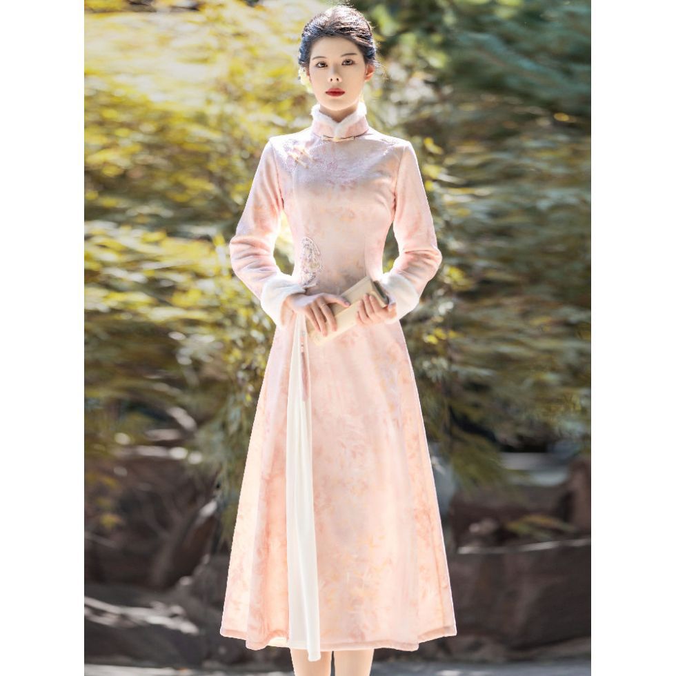 Full-body front view of the pink ao dai with a high collar and white inner pleat, creating a layered, graceful silhouette.
